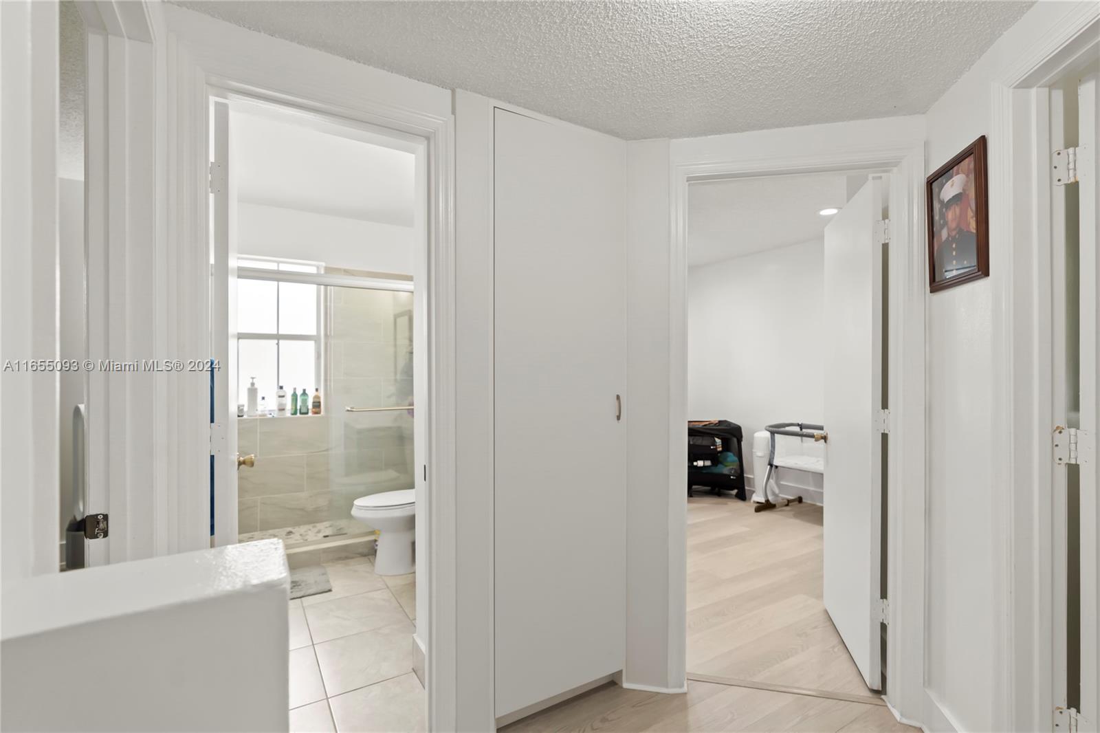 5301 Southwest 126th Terrace, Unit 5301 Miramar, FL 33027 - Photo 29 of 37 a bathroom with a tub and a glass door