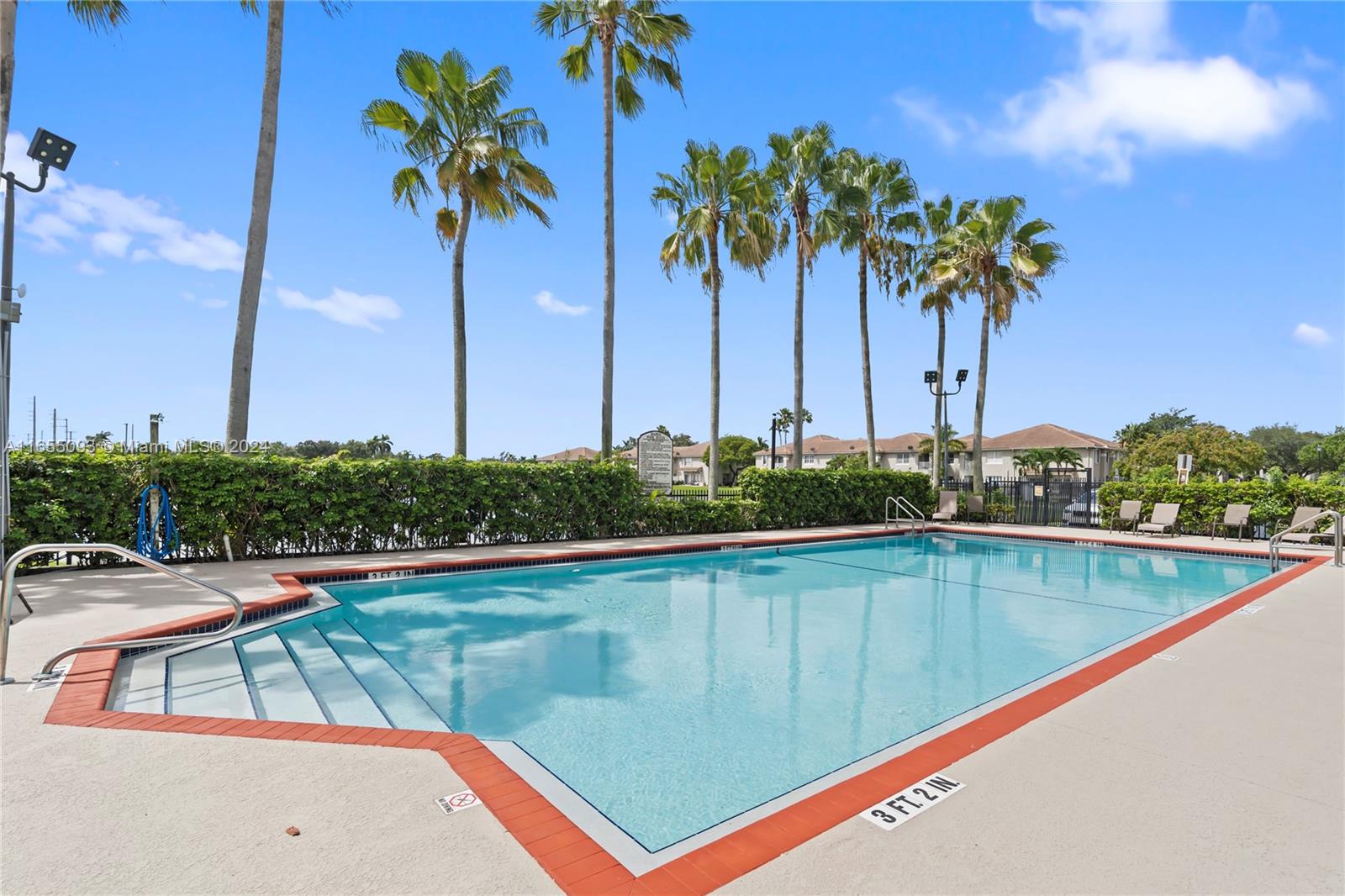 5301 Southwest 126th Terrace, Unit 5301 Miramar, FL 33027 - Photo 34 of 37 a view of swimming pool with a table and chairs