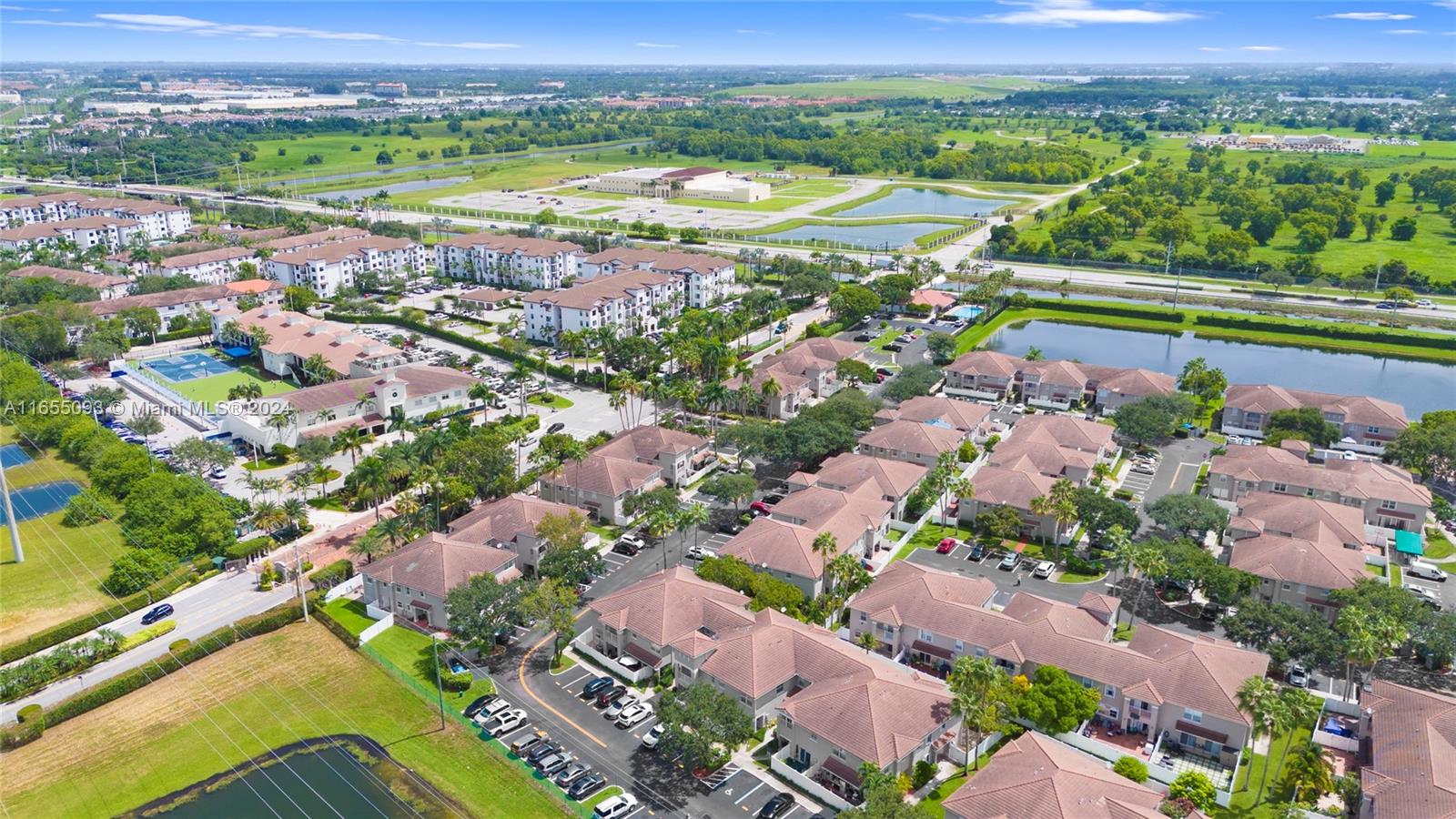 5301 Southwest 126th Terrace, Unit 5301 Miramar, FL 33027 - Photo 37 of 37 an aerial view of a city with lots of residential buildings ocean and mountain view in back