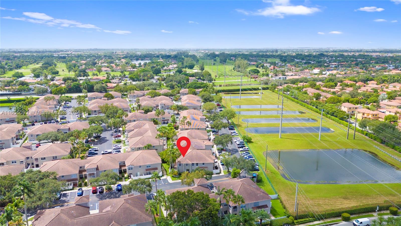 5301 Southwest 126th Terrace, Unit 5301 Miramar, FL 33027 - Photo 5 of 37 an aerial view of residential houses with outdoor space and swimming pool