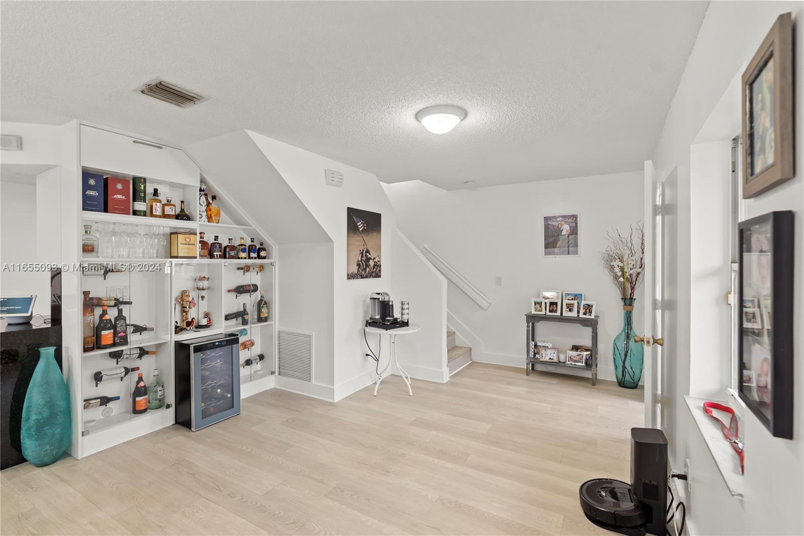 5301 Southwest 126th Terrace, Unit 5301 Miramar, FL 33027 - Photo 7 of 37 a view of living room with furniture and flat screen tv