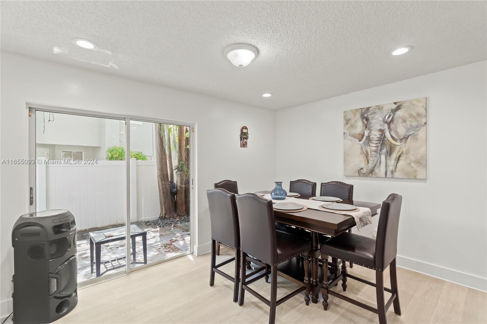 5301 Southwest 126th Terrace, Unit 5301 Miramar, FL 33027 - Photo 8 of 37 a view of a dining room with furniture
