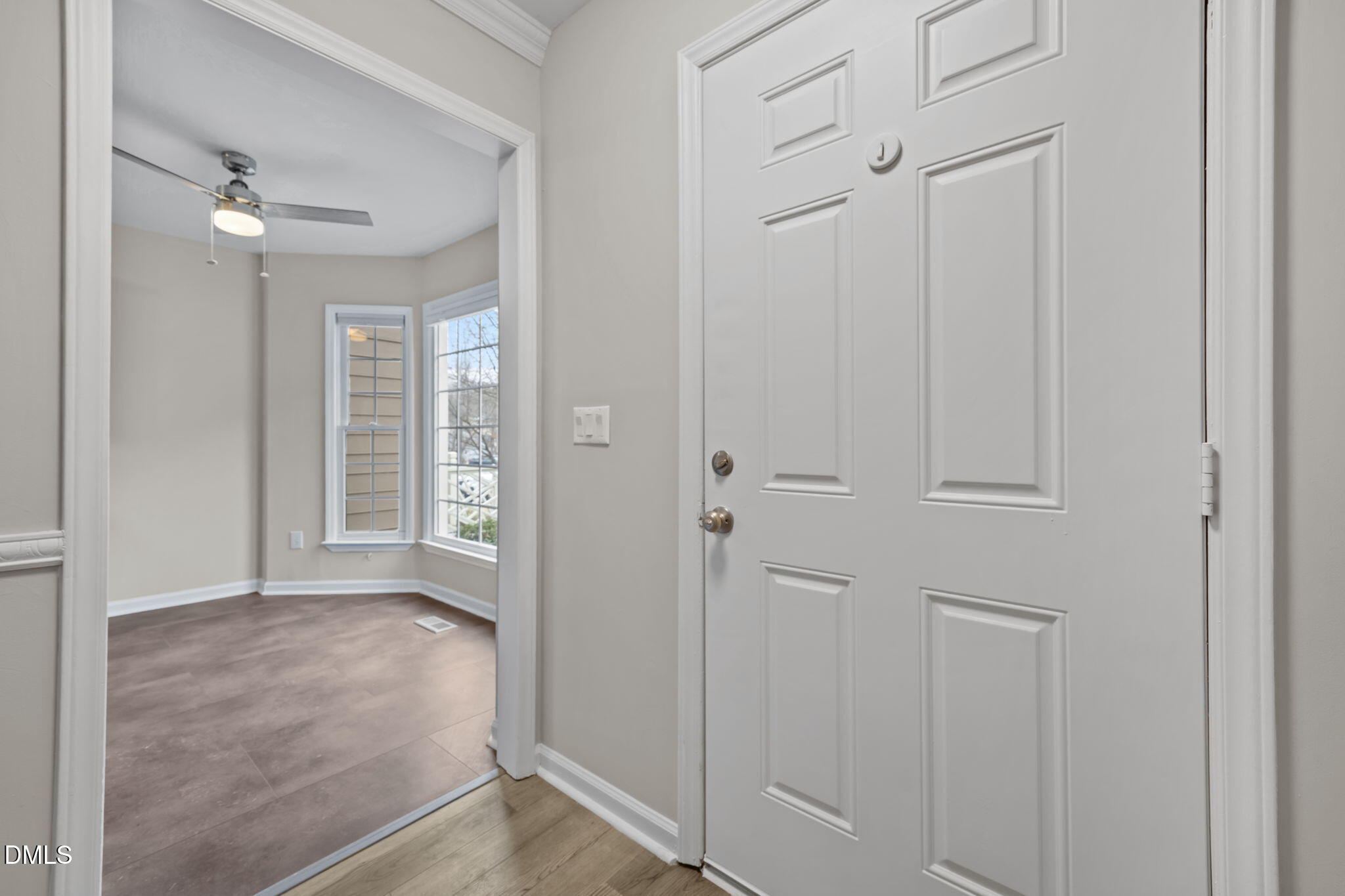 2813 Bedfordshire Court Raleigh, NC 27604 - Photo 9 of 46 wooden floor in a hall with an entryway