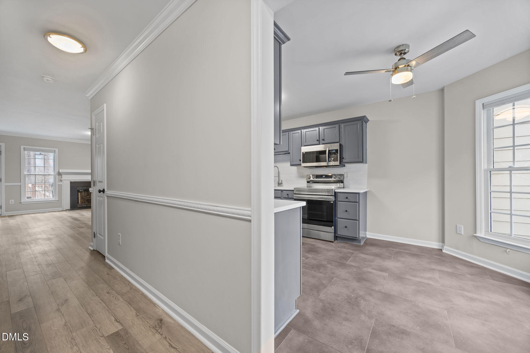 2813 Bedfordshire Court Raleigh, NC 27604 - Photo 10 of 46 a view of a kitchen with furniture and an empty room