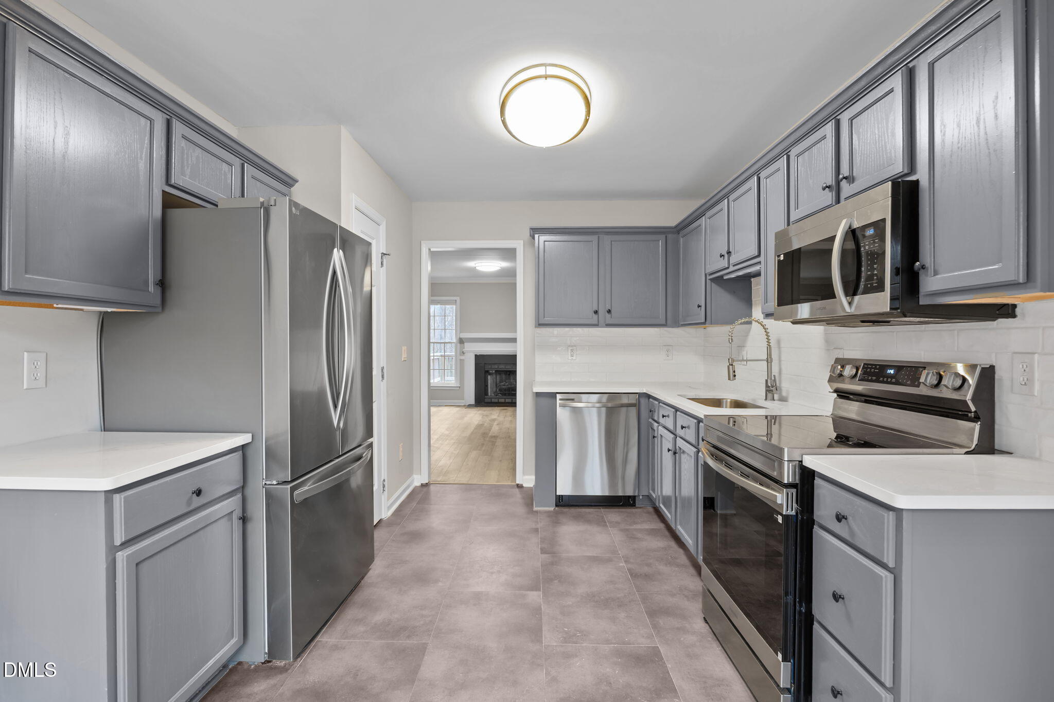2813 Bedfordshire Court Raleigh, NC 27604 - Photo 13 of 46 a kitchen with stainless steel appliances granite countertop a refrigerator stove and sink