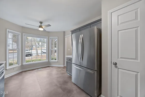 a stove top oven sitting inside of a kitchen