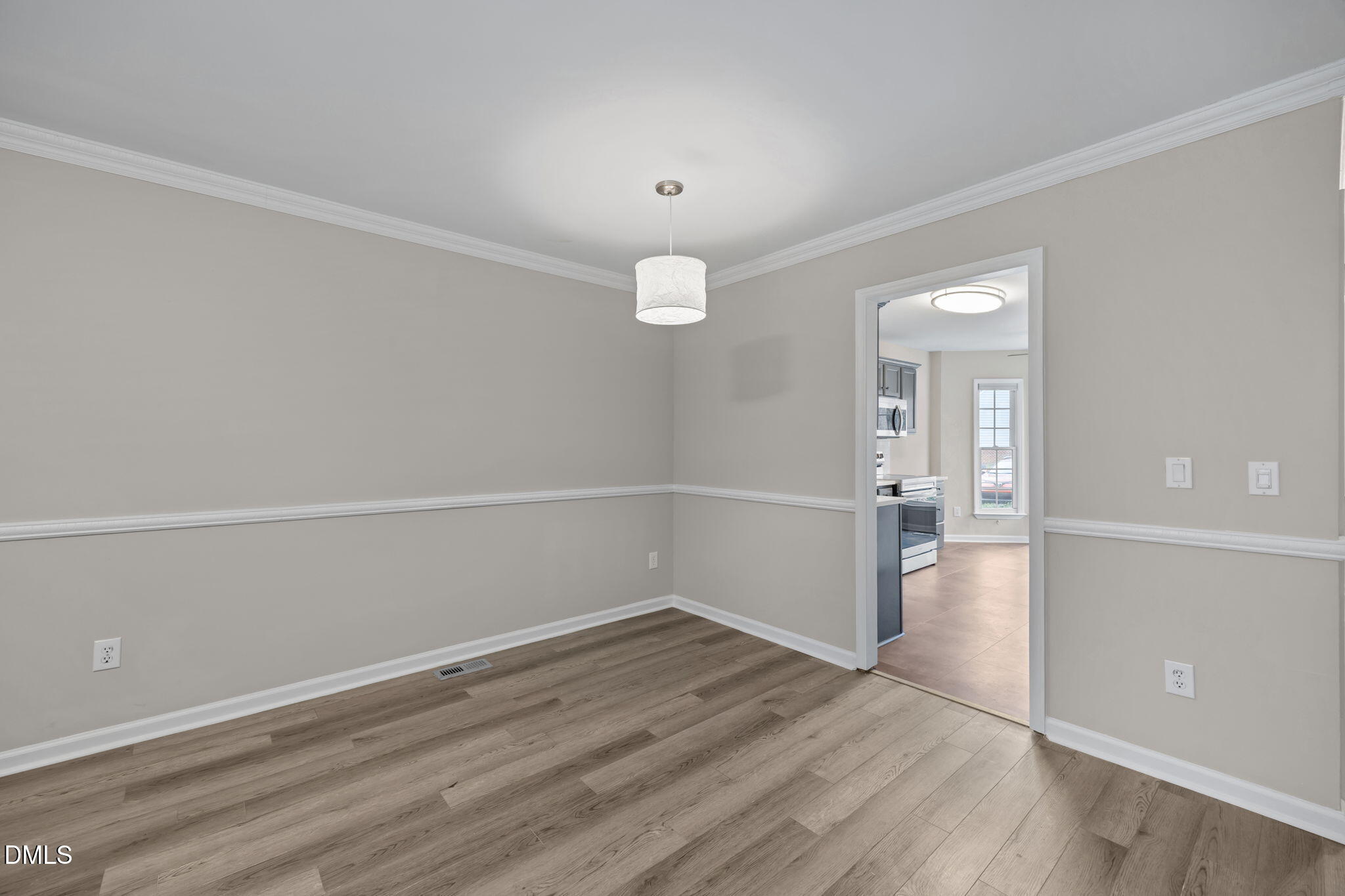 2813 Bedfordshire Court Raleigh, NC 27604 - Photo 19 of 46 wooden floor in an empty room