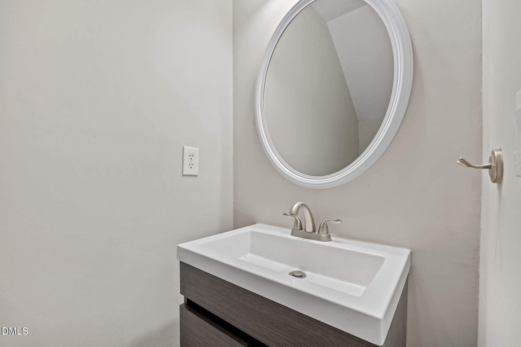 2813 Bedfordshire Court Raleigh, NC 27604 - Photo 21 of 46 a bathroom with a sink and a mirror
