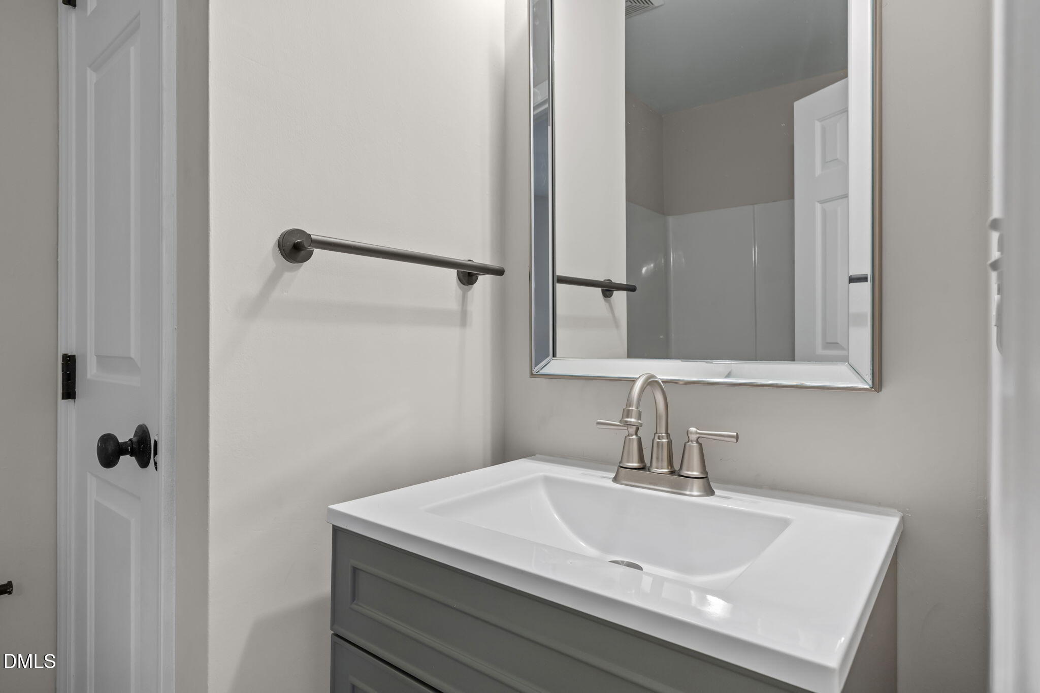 2813 Bedfordshire Court Raleigh, NC 27604 - Photo 26 of 46 a bathroom with a sink and a mirror