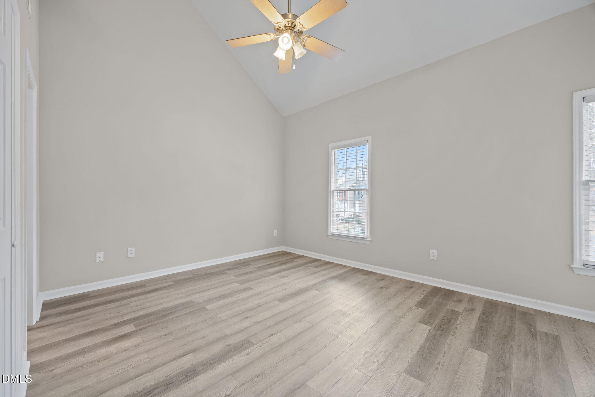 2813 Bedfordshire Court Raleigh, NC 27604 - Photo 28 of 46 wooden floor in an empty room with a window