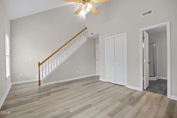 wooden floor in an empty room with a window