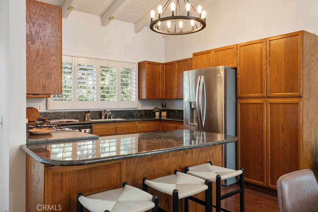 235 Spinks Canyon Road Duarte, CA 91010 - Photo 10 of 62 a kitchen with stainless steel appliances granite countertop a refrigerator and a stove top oven