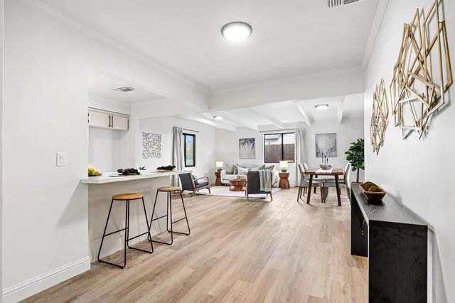 a view of a dining room with furniture window and wooden floor