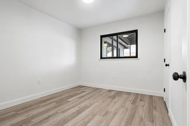 a bathroom with a sink vanity and a mirror