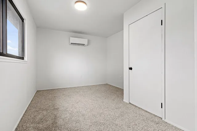 a view of a livingroom with an empty space and a ceiling fan