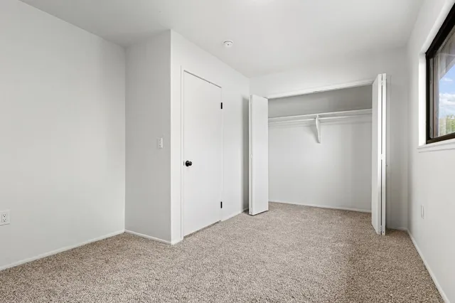 a view of house with backyard and glass area