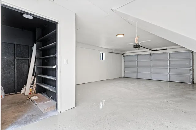 a view of a house with a door and wooden walls