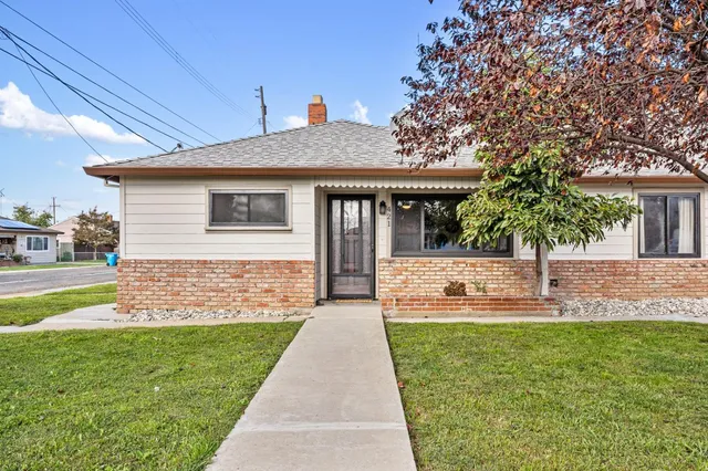a front view of a house with garden