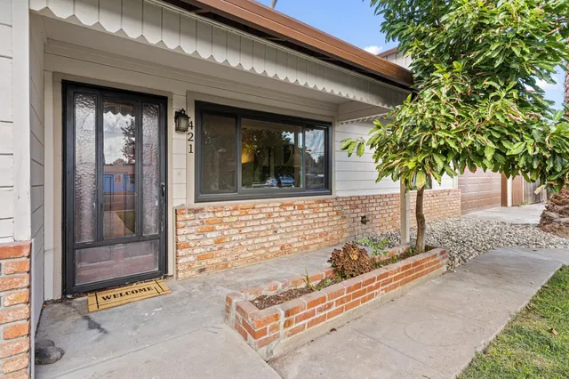a front view of a house with a yard
