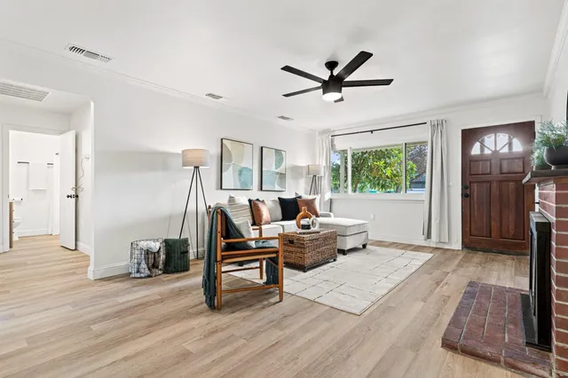 a living room with furniture and a window