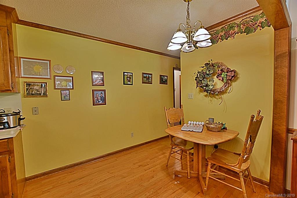 3550 Dobys Bridge Road Fort Mill, SC 29715 - Photo 13 of 48 a view of a dining room with furniture and a chandelier