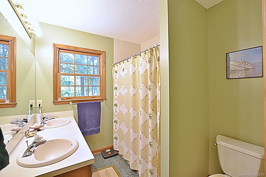 3550 Dobys Bridge Road Fort Mill, SC 29715 - Photo 16 of 48 a bathroom with a sink a toilet and tub