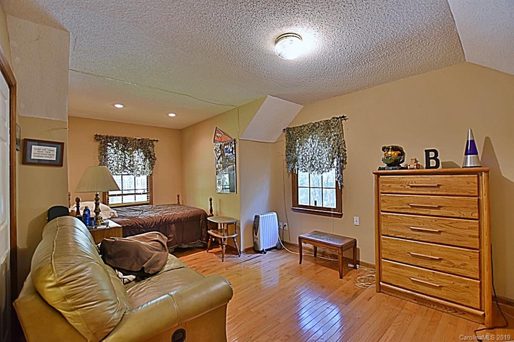 3550 Dobys Bridge Road Fort Mill, SC 29715 - Photo 18 of 48 a living room with furniture and wooden floor