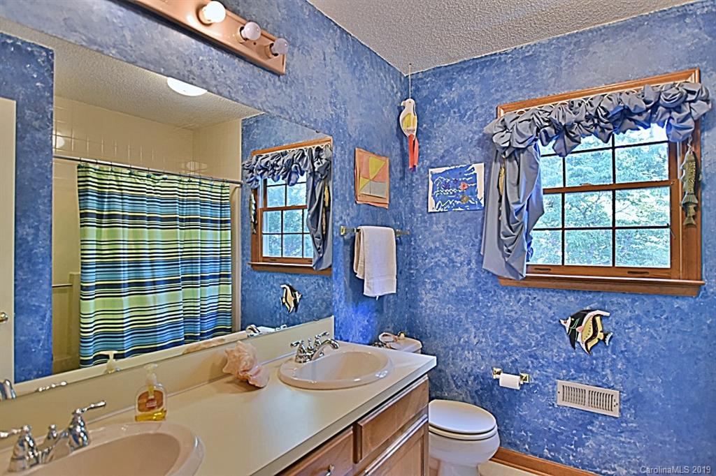 3550 Dobys Bridge Road Fort Mill, SC 29715 - Photo 22 of 48 a bathroom with a sink a toilet and shower