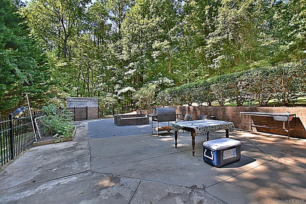 3550 Dobys Bridge Road Fort Mill, SC 29715 - Photo 24 of 48 a backyard of a house with table and chairs