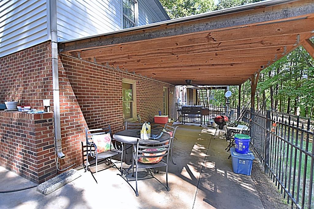 3550 Dobys Bridge Road Fort Mill, SC 29715 - Photo 25 of 48 a sitting area with furniture and wooden fence
