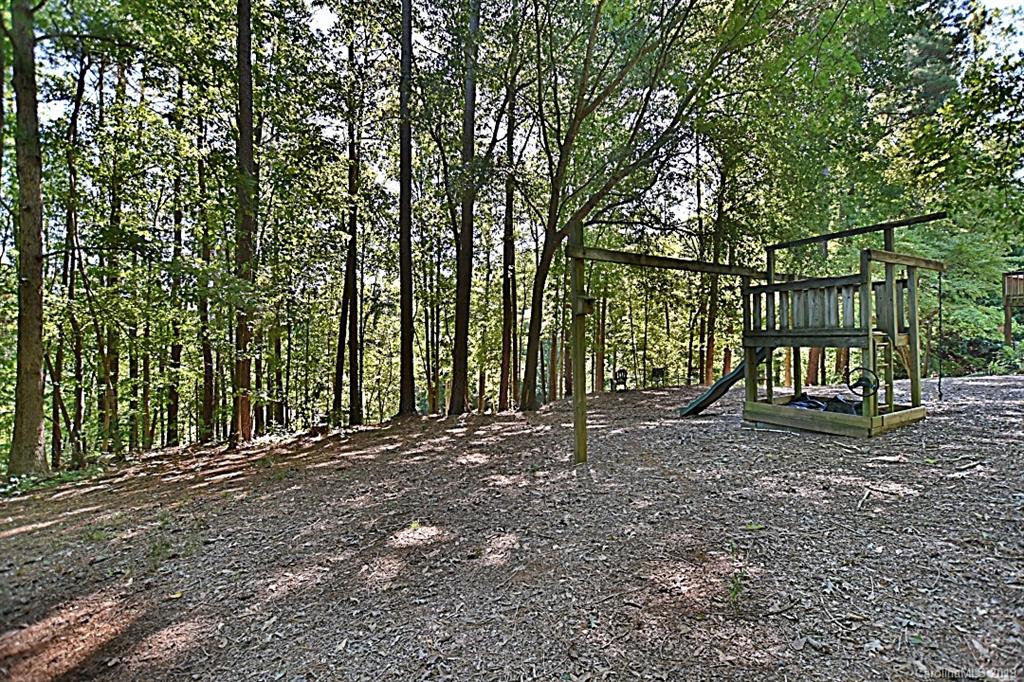 3550 Dobys Bridge Road Fort Mill, SC 29715 - Photo 32 of 48 a view of outdoor space with deck and trees