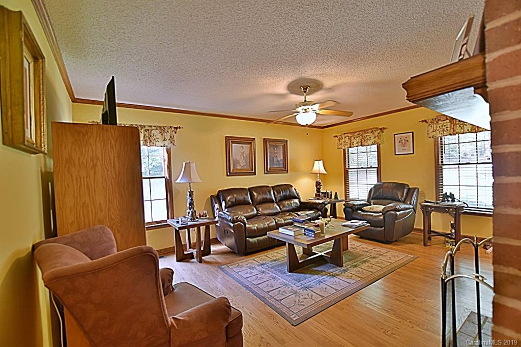 3550 Dobys Bridge Road Fort Mill, SC 29715 - Photo 5 of 48 a living room with furniture and a chandelier