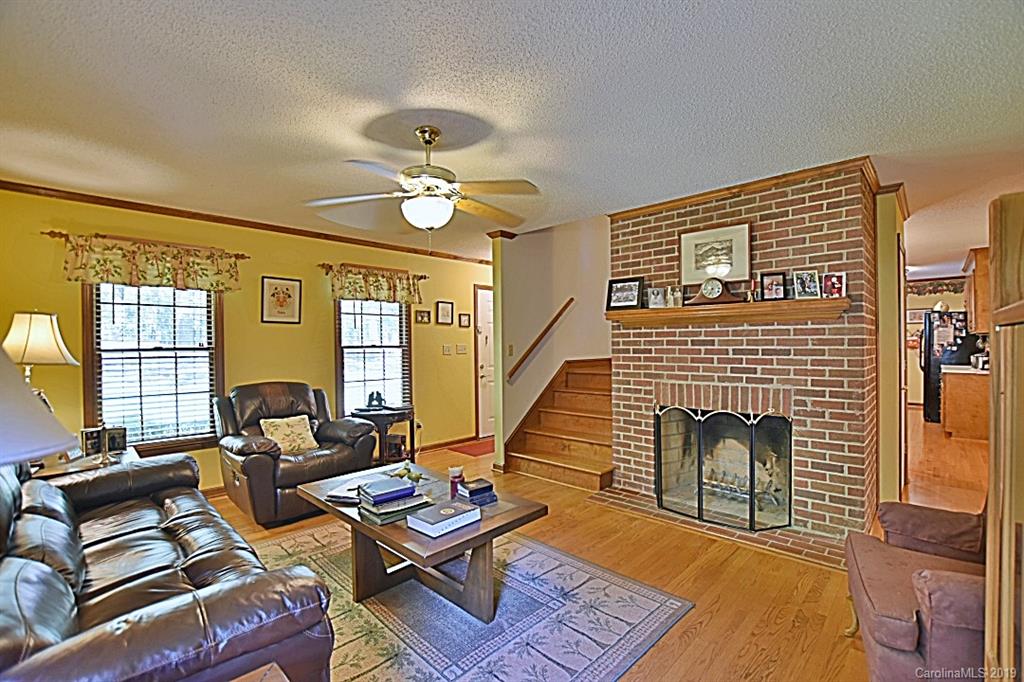 3550 Dobys Bridge Road Fort Mill, SC 29715 - Photo 6 of 48 a living room with furniture fireplace and a table
