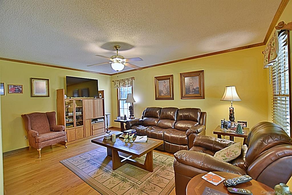 3550 Dobys Bridge Road Fort Mill, SC 29715 - Photo 7 of 48 a living room with furniture and a lamp