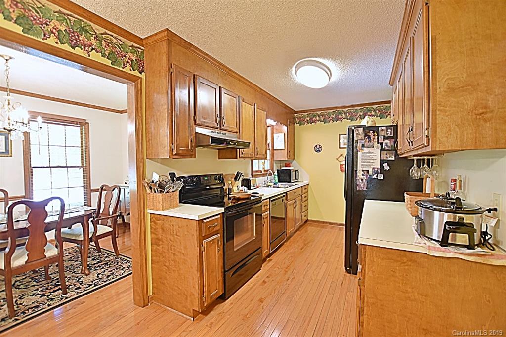 3550 Dobys Bridge Road Fort Mill, SC 29715 - Photo 8 of 48 a kitchen with stainless steel appliances granite countertop a stove and a refrigerator