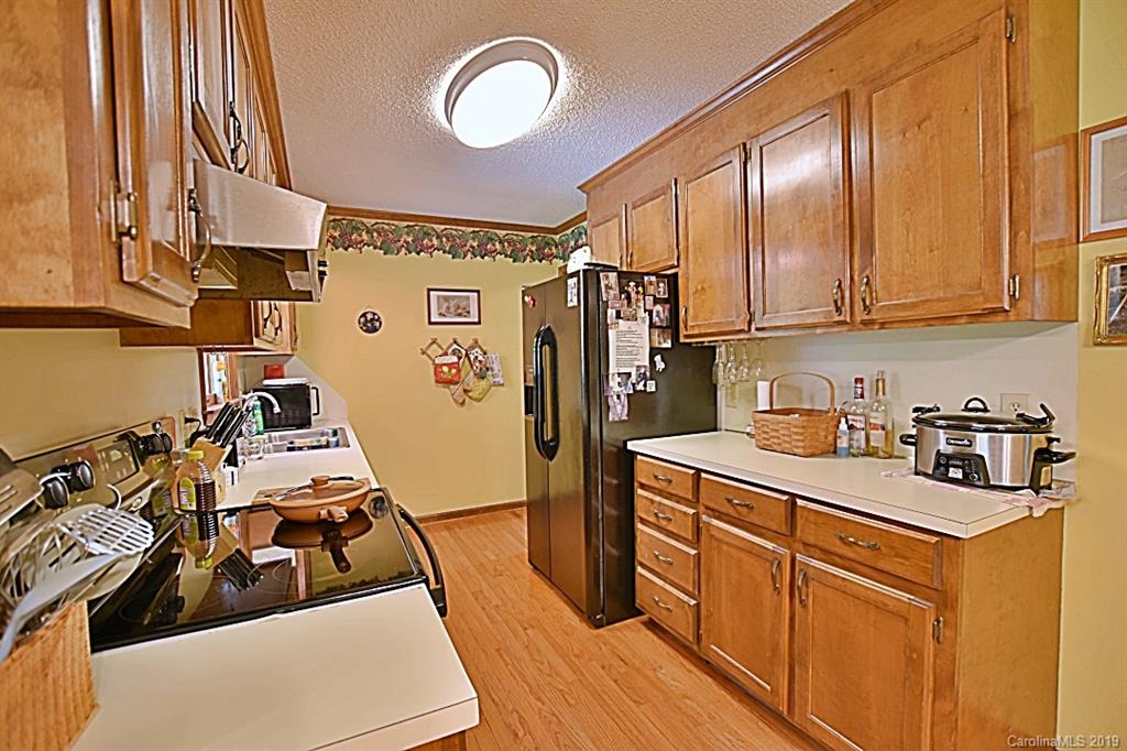 3550 Dobys Bridge Road Fort Mill, SC 29715 - Photo 9 of 48 a kitchen with stainless steel appliances granite countertop a sink stove and refrigerator