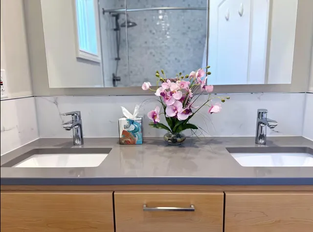 a bathroom with a sink and a mirror