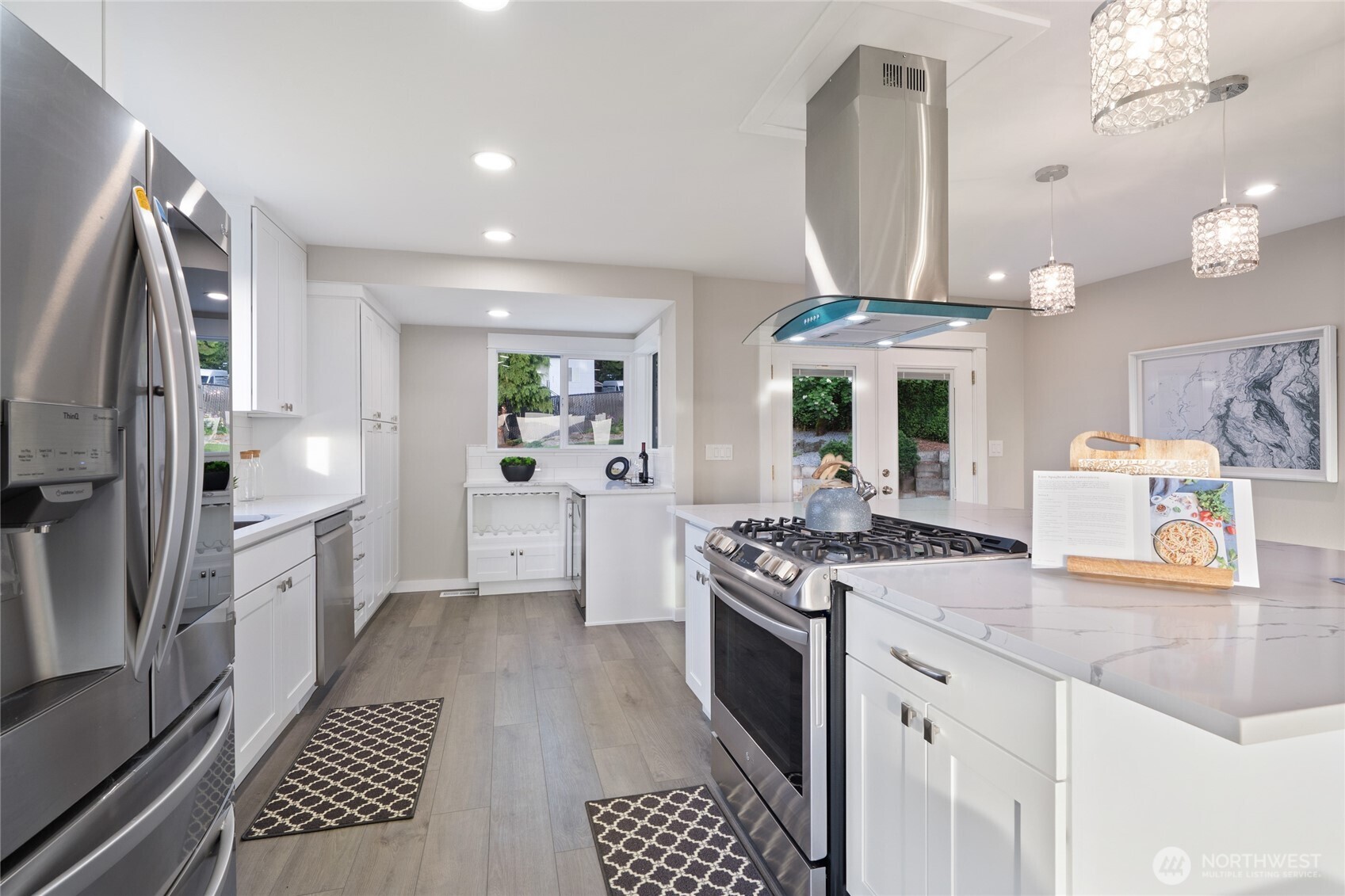 420 Renton Avenue South Renton, WA 98057 - Photo 16 of 40 a kitchen with stainless steel appliances granite countertop a stove a sink dishwasher and a refrigerator