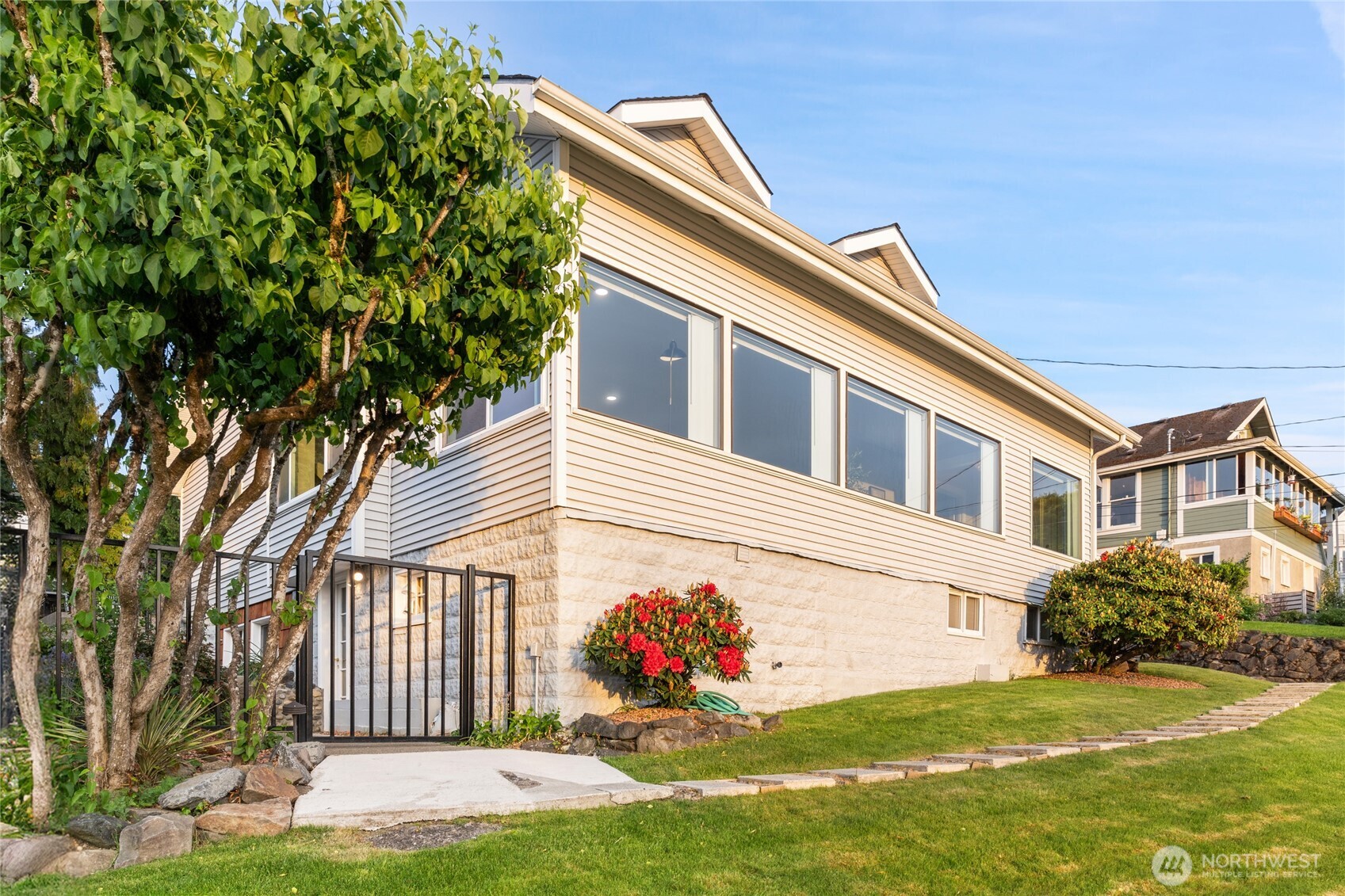 420 Renton Avenue South Renton, WA 98057 - Photo 4 of 40 a front view of a house with a garden and yard