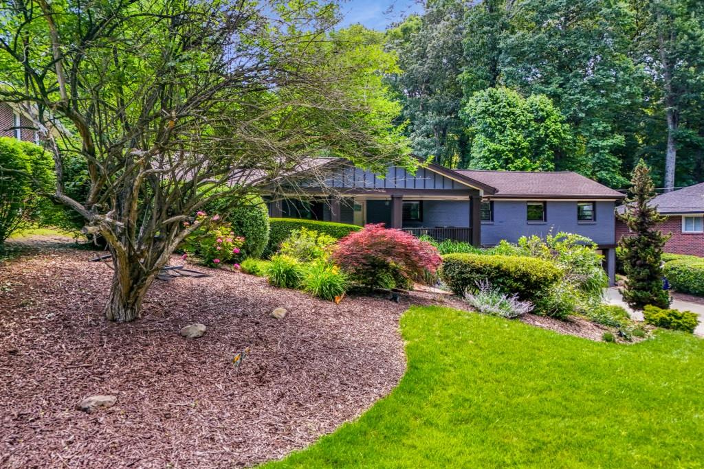 a front view of a house with garden
