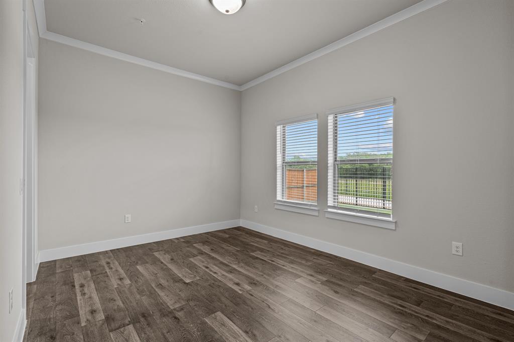 3281 Ganzer Road West, Unit 823A Denton, TX 76207 - Photo 12 of 40 an empty room with a window