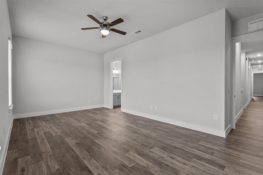 3281 Ganzer Road West, Unit 823A Denton, TX 76207 - Photo 22 of 40 a view of an empty room with wooden floor