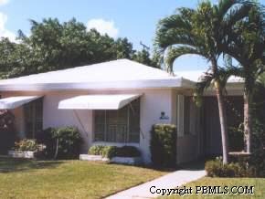 369 Churchill Road West Palm Beach, FL 33405 - Photo 1 of 1 a backyard of a house with table and chairs