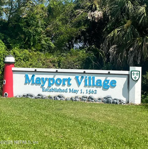 a street sign that is sitting in the grass