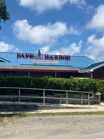 a view of a swimming pool with an outdoor seating