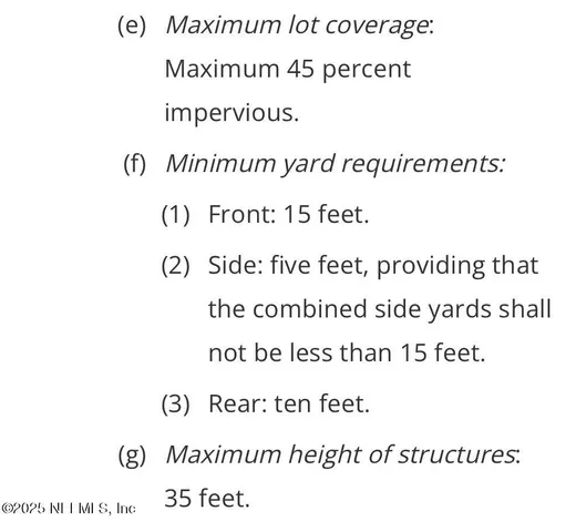 a view of a lake with houses in the back
