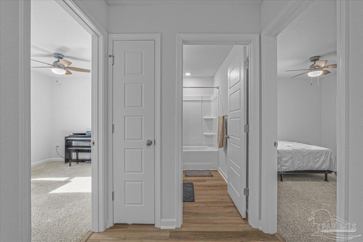 5872 Belmont Stakes Road Pensacola, FL 32526 - Photo 14 of 31 a view of a bathroom from the hallway