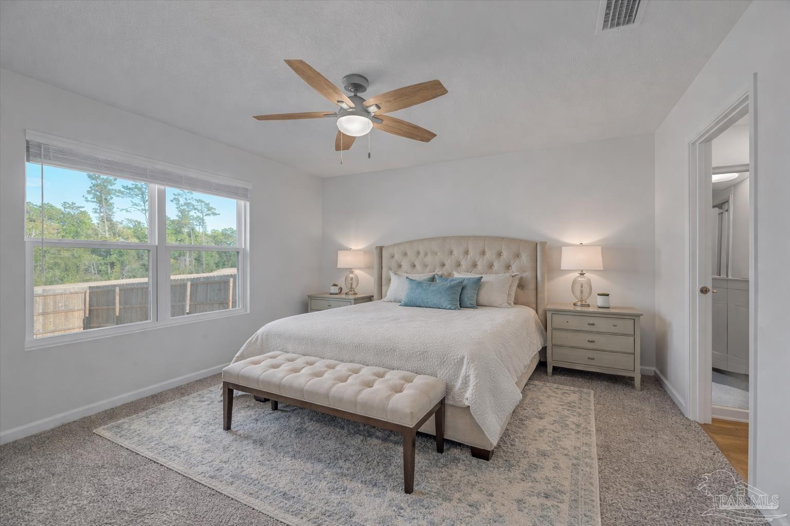 5872 Belmont Stakes Road Pensacola, FL 32526 - Photo 15 of 31 a bedroom with a bed and window