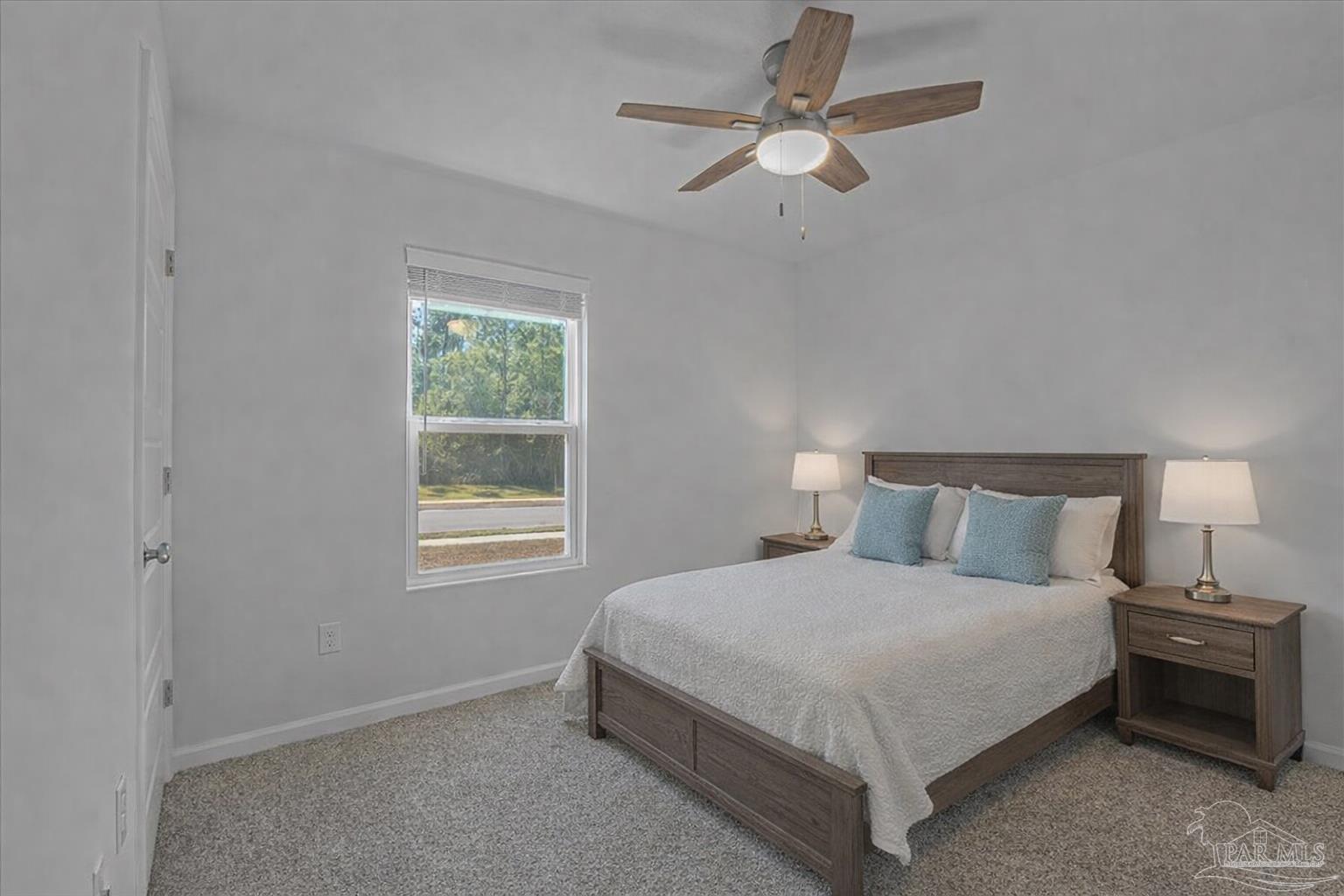 5872 Belmont Stakes Road Pensacola, FL 32526 - Photo 17 of 31 a bedroom with a bed chandelier and window