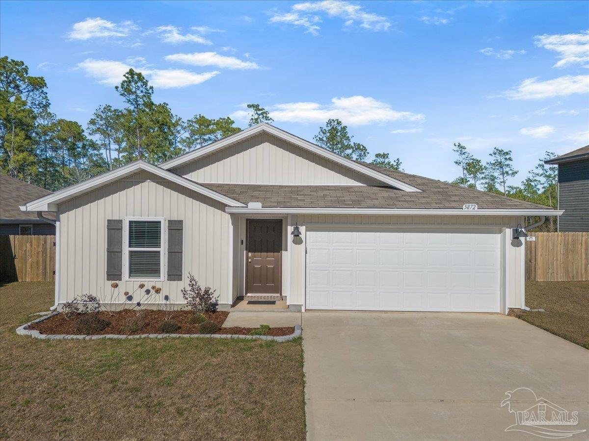 5872 Belmont Stakes Road Pensacola, FL 32526 - Photo 2 of 31 a front view of a house with yard